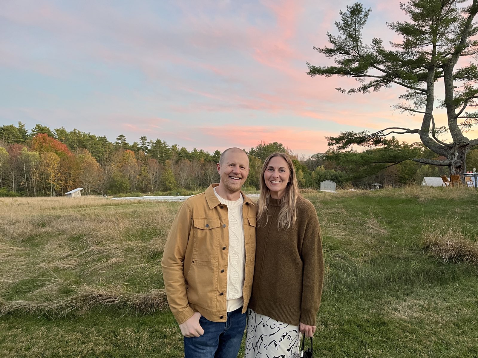 Martin and Katie in a Maine field at sunset